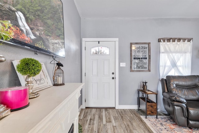 entryway with hardwood / wood-style flooring