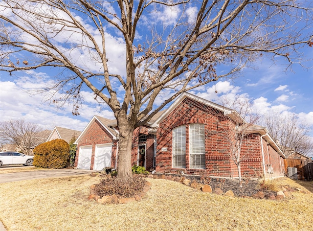 view of front property with a garage and a front lawn