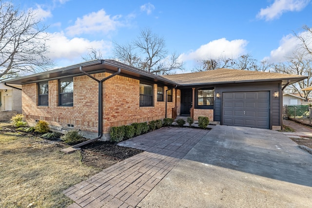 ranch-style home with a garage