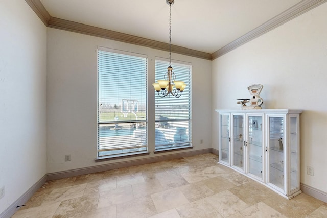 unfurnished dining area with a notable chandelier, crown molding, and baseboards