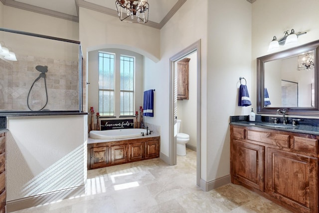 bathroom featuring crown molding, tiled shower, toilet, and a notable chandelier