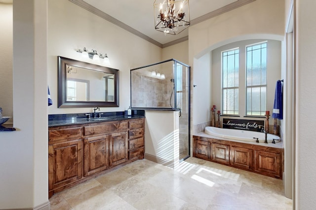 bathroom featuring a chandelier, vanity, ornamental molding, a shower stall, and a bath