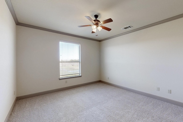 unfurnished room featuring ornamental molding, visible vents, light carpet, and baseboards