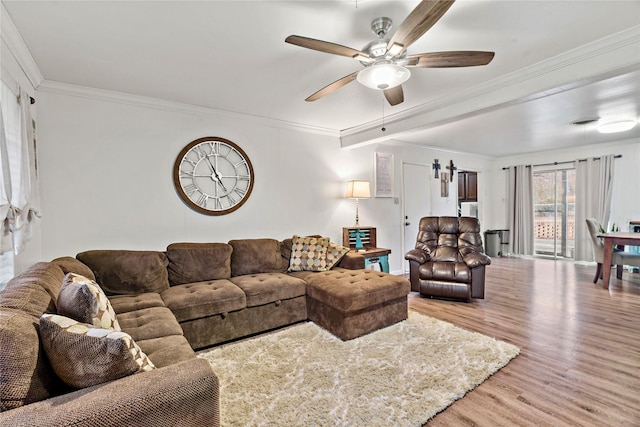 living room with crown molding, ceiling fan, and light hardwood / wood-style floors