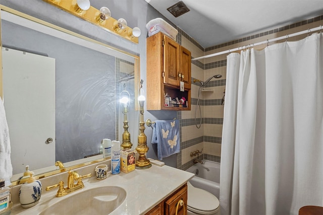 full bathroom with vanity, shower / bath combination with curtain, and toilet