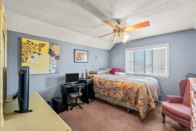 bedroom featuring ceiling fan, vaulted ceiling, carpet, and a textured ceiling