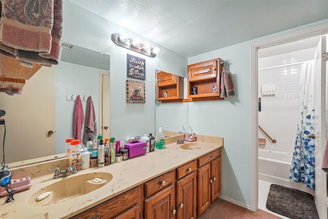 bathroom featuring vanity, a textured ceiling, and shower / bath combo with shower curtain