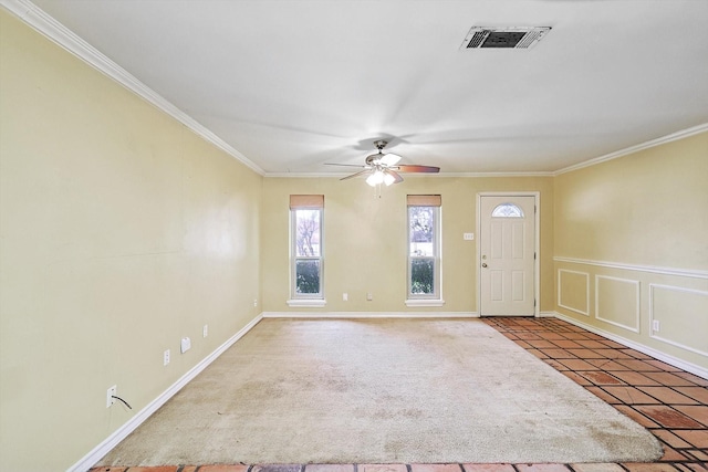 foyer entrance featuring crown molding, tile patterned floors, and ceiling fan