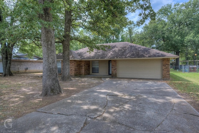 ranch-style home featuring a garage