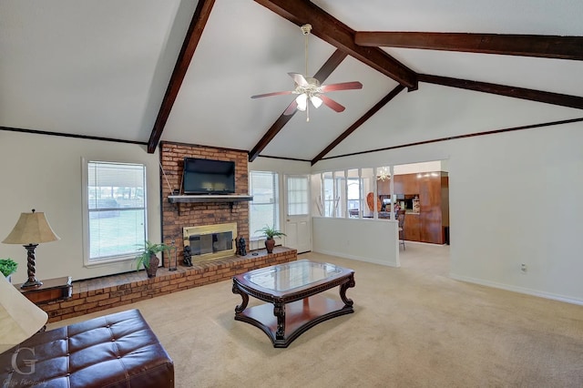 carpeted living room with ceiling fan, a fireplace, high vaulted ceiling, and a wealth of natural light