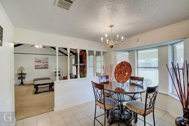 tiled dining room featuring a notable chandelier, ornamental molding, and a textured ceiling