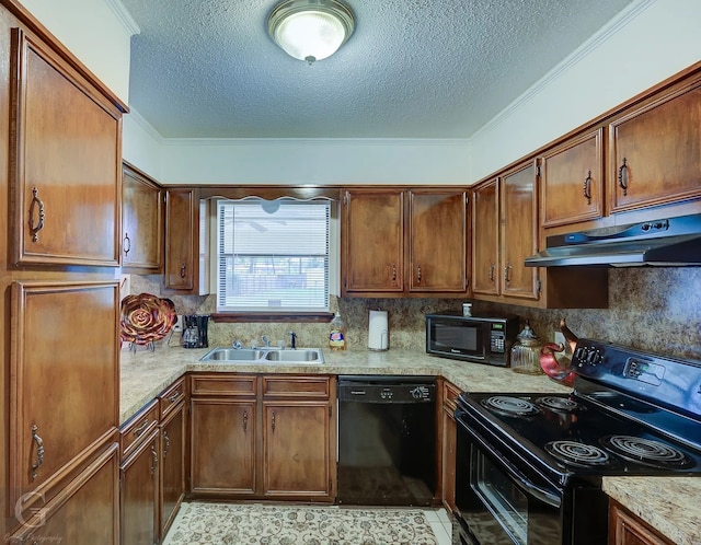 kitchen with tasteful backsplash, sink, light stone counters, black appliances, and a textured ceiling