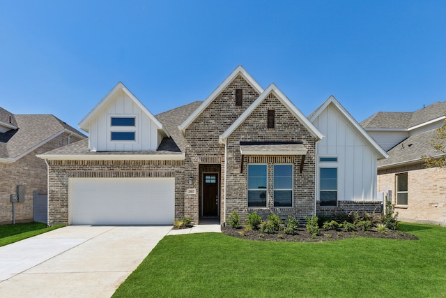 view of front of house featuring a garage and a front yard