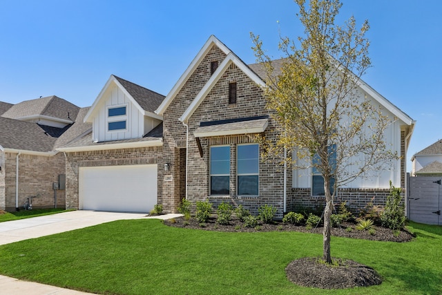 view of front of home featuring a garage and a front lawn