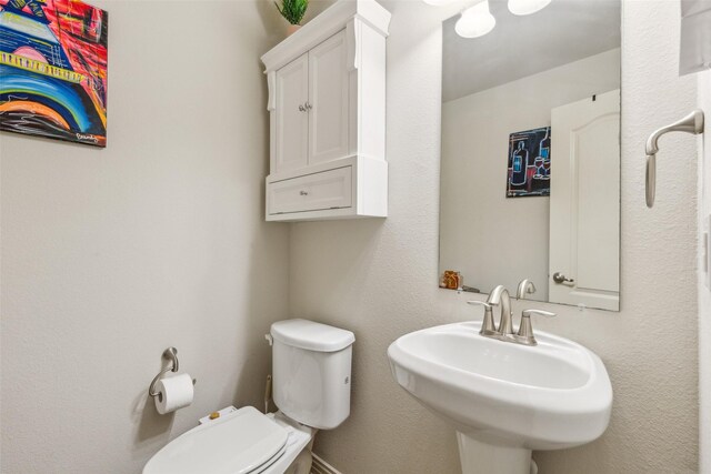 bathroom with sink and toilet