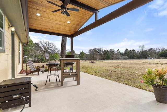 view of patio with a rural view and ceiling fan