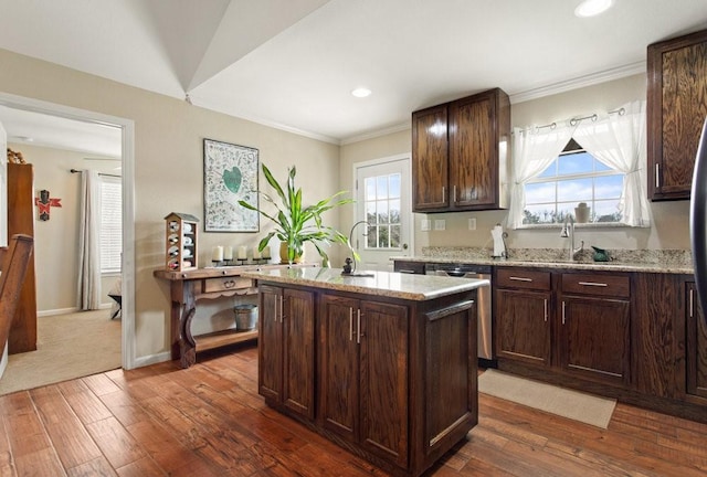 kitchen with stainless steel dishwasher, dark brown cabinetry, dark hardwood / wood-style flooring, and a center island