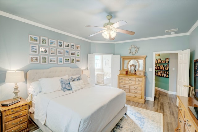 bedroom with crown molding, ceiling fan, connected bathroom, and light hardwood / wood-style flooring