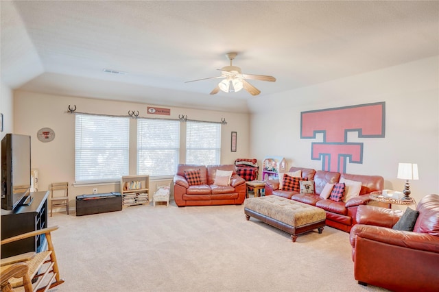 living room with vaulted ceiling, carpet flooring, and ceiling fan