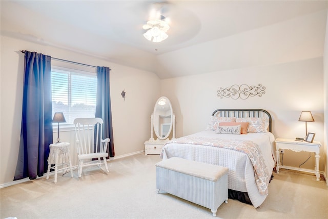 bedroom with vaulted ceiling, carpet floors, and ceiling fan