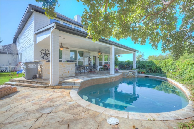 view of pool with ceiling fan and a patio area