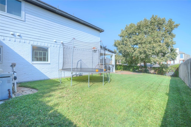 view of yard with a trampoline