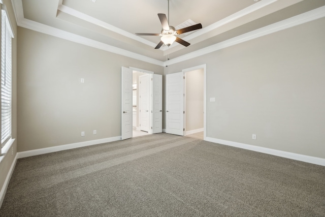 1017 Daisy Way, Crowley, TX 76036 - empty room featuring a tray ceiling, a ceiling fan, light colored carpet, crown molding, and baseboards