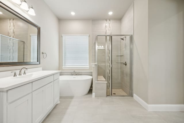 1017 Daisy Way, Crowley, TX 76036 - bathroom with a stall shower, tile patterned flooring, vanity, a freestanding tub, and recessed lighting