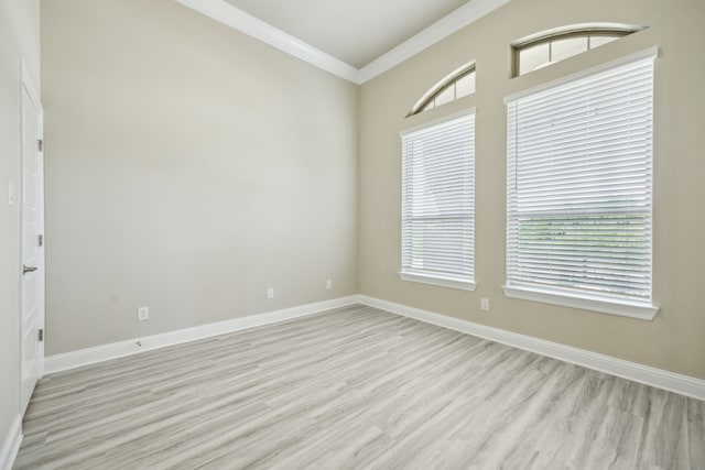 1017 Daisy Way, Crowley, TX 76036 - unfurnished room with light wood finished floors, ornamental molding, and baseboards