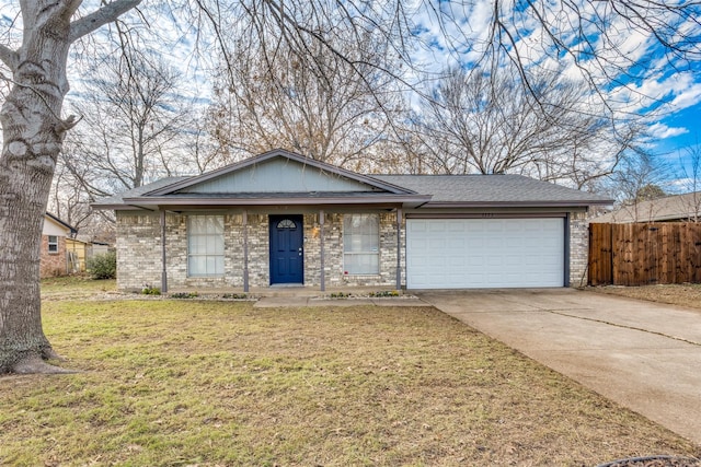 ranch-style home with a garage and a front yard