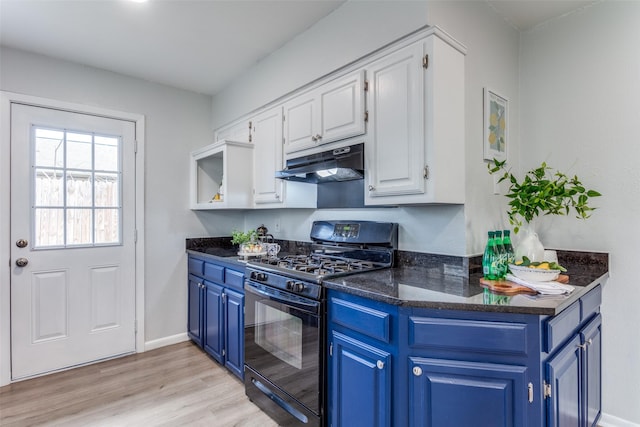 kitchen with blue cabinetry, white cabinetry, light wood-type flooring, black gas stove, and dark stone counters