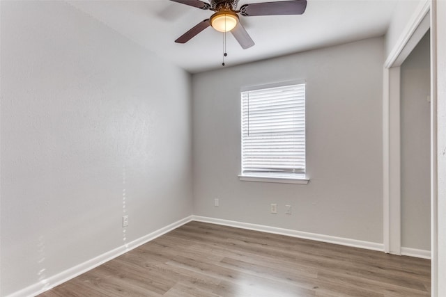 unfurnished room with ceiling fan and light wood-type flooring