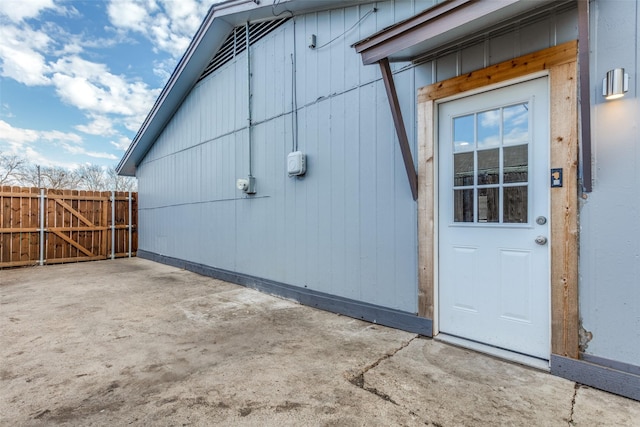 view of side of property with a patio area