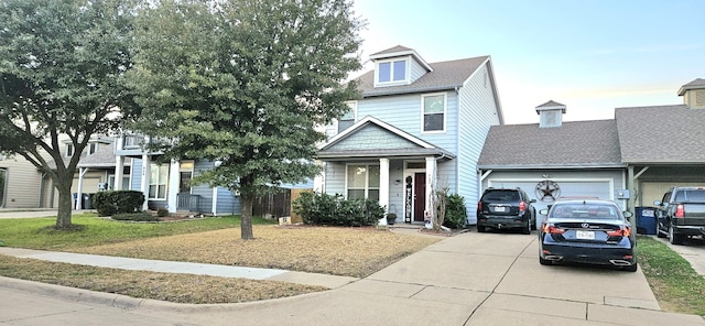 view of front of house with a garage and a front yard