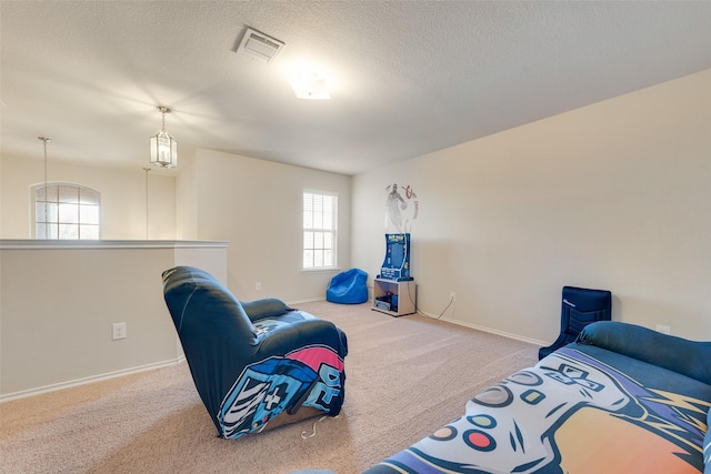 carpeted bedroom featuring a textured ceiling