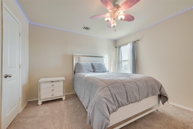 bedroom featuring light carpet and ceiling fan