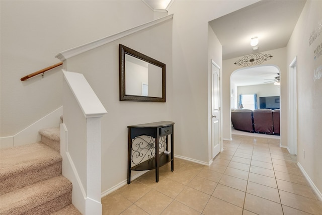 hall featuring light tile patterned floors