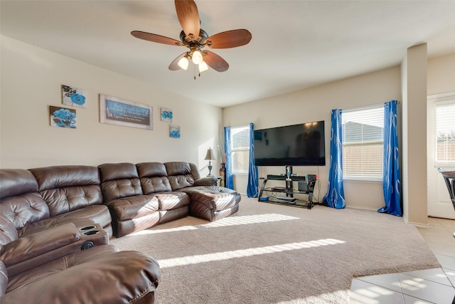 carpeted living room with ceiling fan