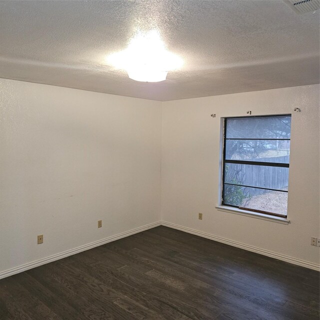 134 Hollie Dr, Red Oak, TX 75154 - unfurnished room with a textured ceiling and dark hardwood / wood-style flooring