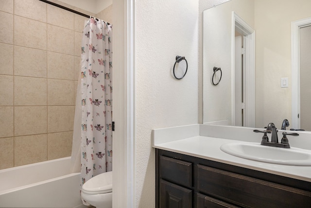 full bathroom with vanity, shower / bath combination with curtain, and toilet