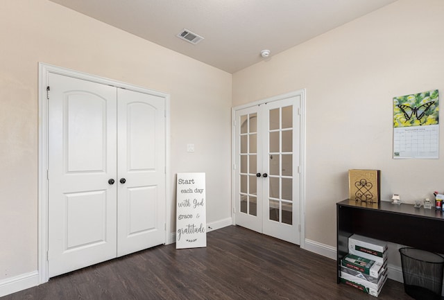 home office with french doors and dark wood-type flooring