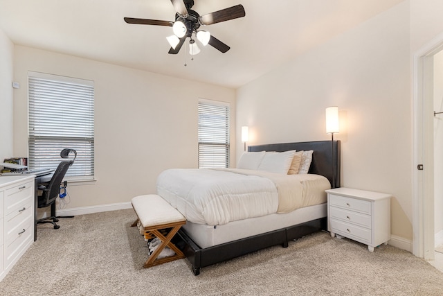 bedroom with ceiling fan and light colored carpet