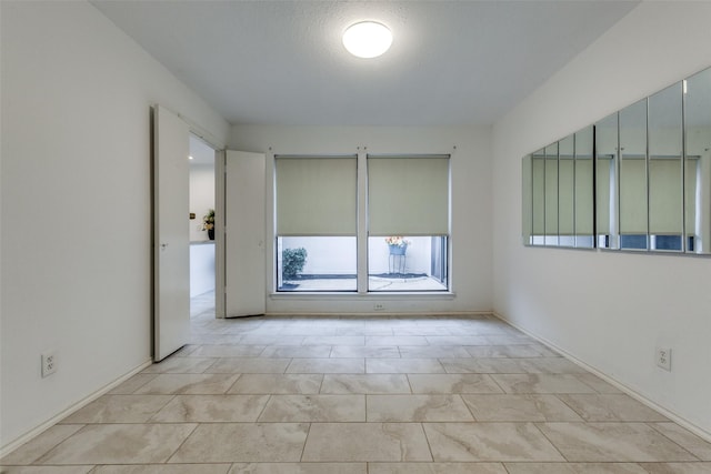 empty room featuring a textured ceiling