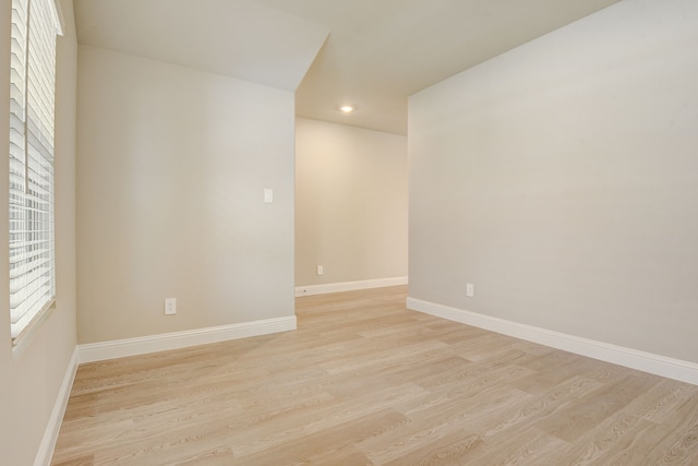 spare room featuring light hardwood / wood-style flooring