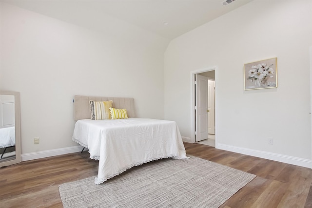 bedroom featuring wood-type flooring