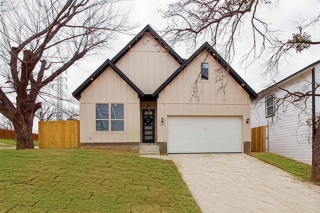 view of front of property featuring a garage and a front lawn