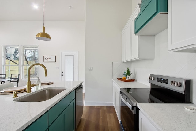 kitchen with sink, white cabinetry, pendant lighting, stainless steel appliances, and light stone countertops