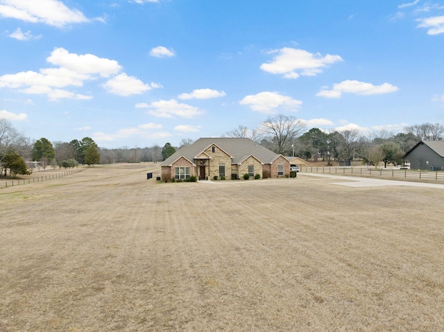 view of front of property with a rural view