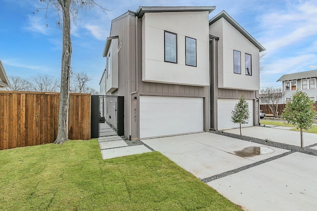 view of front of property with a garage and a front yard