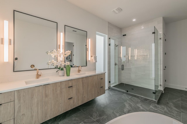 bathroom featuring vanity and plus walk in shower